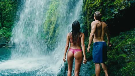 Couple-Relaxing-Under-Waterfall