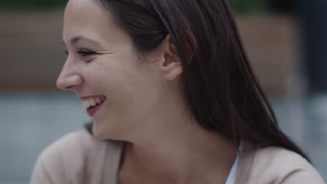 Young-Happy-Smiling-Man-and-Woman-are-Communicating-Outdoors.-Close-up,-Slow-Motion-Shot.