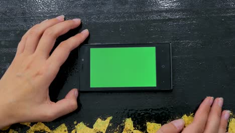 Woman-using-smartphone-with-green-screen