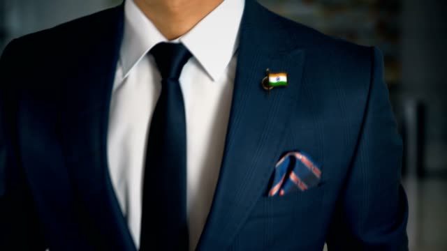 Businessman-Walking-Towards-Camera-With-Country-Flag-Pin---India