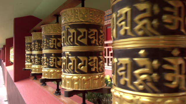 Some-Tibetan-prayer-wheels-are-turning-in-a-Buddhist-temple-in-India.