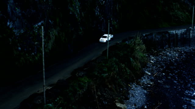 Car-Going-Near-the-Sea-Along-Mountain-Slopes.-Aerial-Shot-from-Madeira.