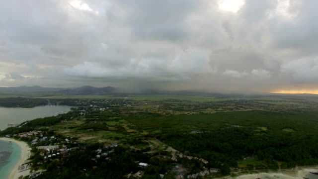 Flying-over-Mauritius-Island-with-low-clouds