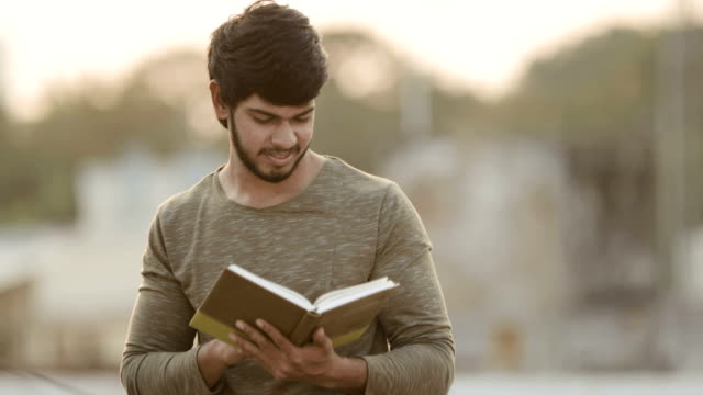 Young-man-reading-book