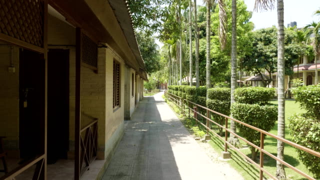 Green-courtyard-of-the-hotel-in-asia.-Village-in-Chitwan-national-park,-Nepal.