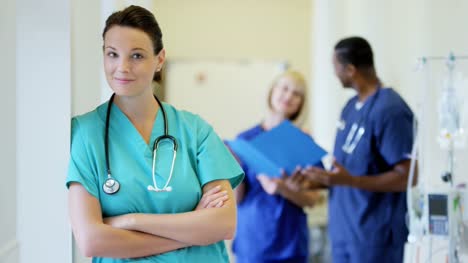 Portrait-of-Caucasian-female-hospital-staff-wearing-scrubs