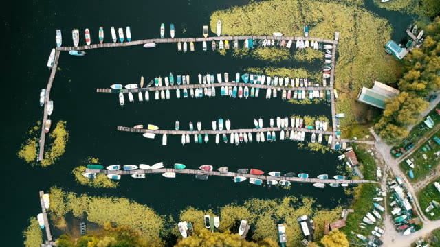 Pier-speedboat.-A-marina-lot.-This-is-usually-the-most-popular-tourist-attractions-on-the-beach.-Yacht-and-sailboat-is-moored-at-the-quay.-Aerial-view-by-drone.-Top-view
