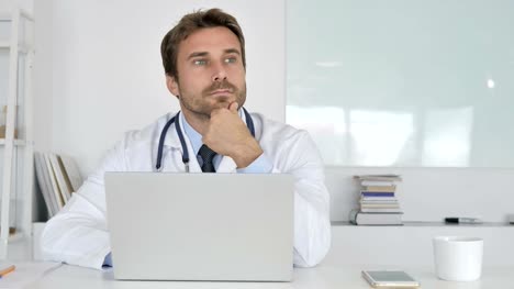 Pensive-Doctor-Sitting-in-Clinic-and-Thinking