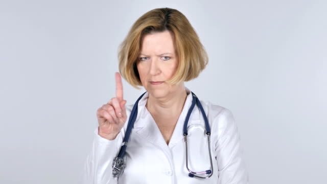 Portrait-of-Old-Doctor-Waving-Finger-to-Refuse