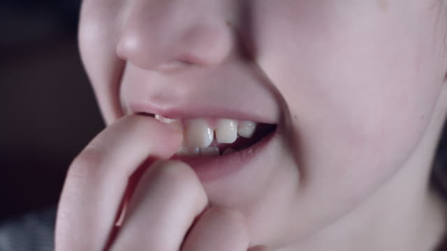 4k-Close-Up-Child-Cleaning-Dirt-from-his-Teeth