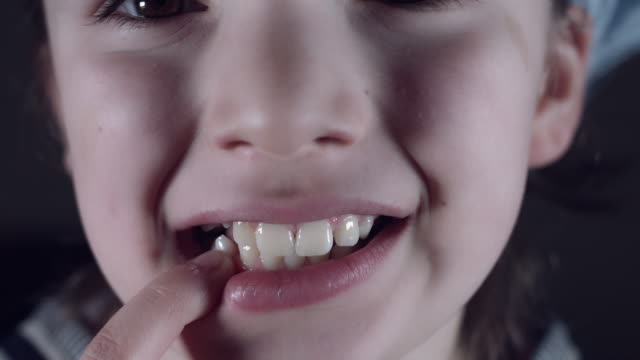 4k-Close-Up-Child-Mouth-Showing-Wiggling-Tooth