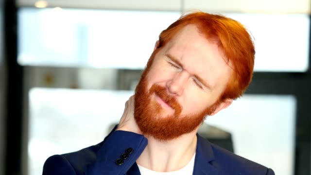 Tired-Businessman-with-Red-Hair,-Beard
