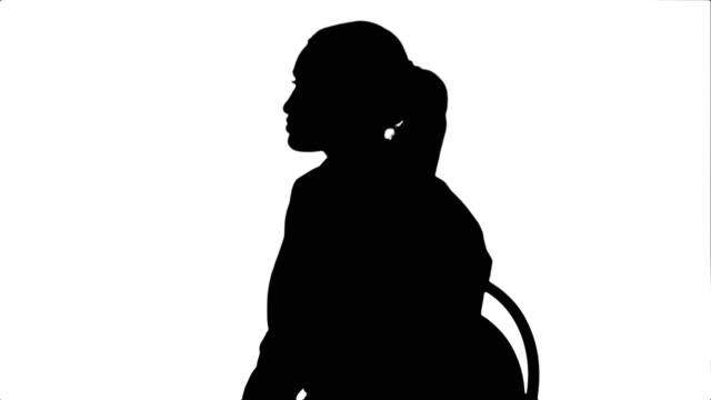 Silhouette-Female-doctor-talking-with-patient-and-writing-a-recipe