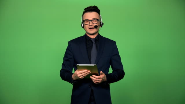 Newscaster-with-tablet-and-headset