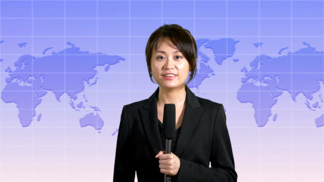 News-presenter-in-studio-with-map-display-in-background
