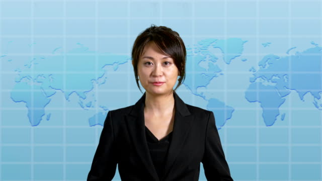 News-presenter-in-studio-with-map-display-in-background