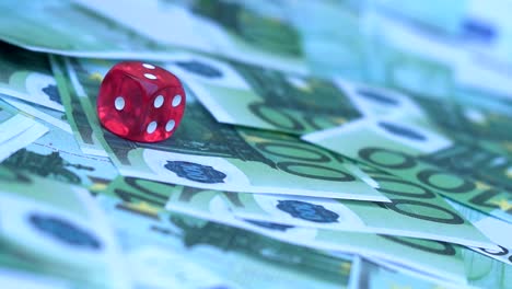 Red-dice-falling-on-100-euro-money-bill