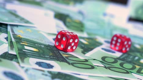 Red-dice-falling-on-euro-money