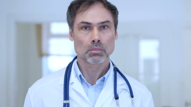 Portrait-of-Serious-Doctor-in-Hospital