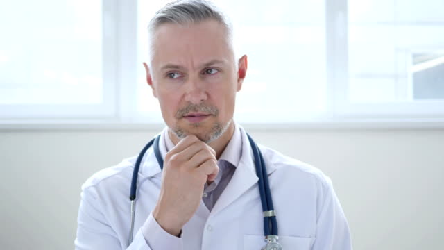 Pensive-Doctor-Thinking-about-Patient-Health