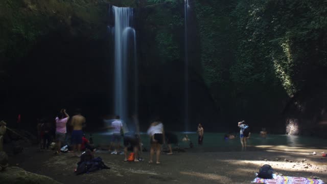 4K-UHD-long-exposure-time-lapse-of-tourists-in-awaterfall-in-Bali,-Indonesia