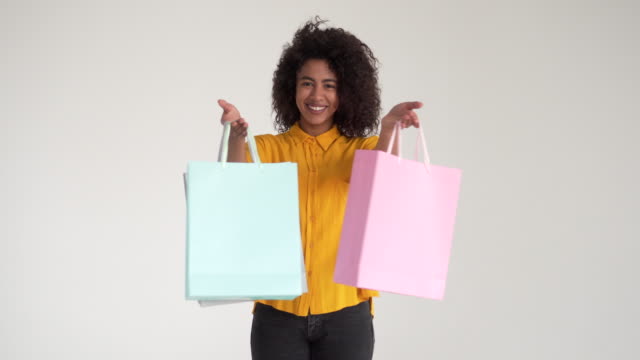 African-american-woman-holding-shopping-bags
