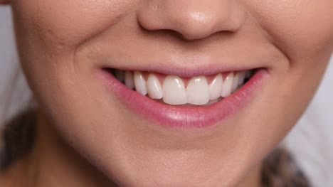 Extreme-closeup-of-woung-woman's-mouth-smiling