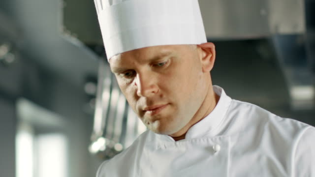Close-up-of-a-Famous-Chef-Concentrated-on-Cooking-Perfect-Dish.