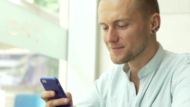 Man-using-app-on-smartphone