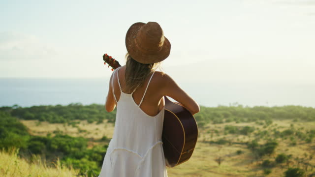 Young-Woman-Playing-Guitar