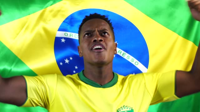 Brazilian-Young-Black-Man-Celebrating-with-Brazil-Flag