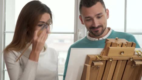 Young-man-and-woman-draws-a-picture