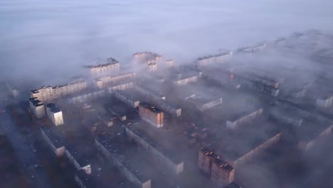 Beautiful-view-from-bird's-eye-view-to-very-dense-morning-fog-over-city.