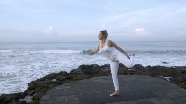 Woman-Doing-Dancers-Yoga-Pose