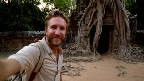 Male-taking-selfie-portrait-at-ancient-temple