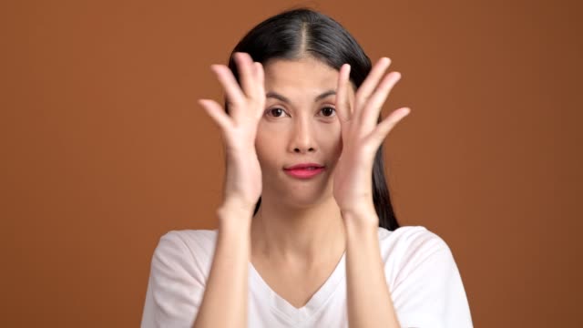 Girl-playing-hide-and-seek-portrait.-Asian-woman-in-white-t-shirt-cover-her-eyes-with-her-hands-for-hide-and-seek.