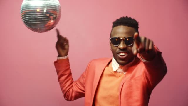 Man-with-Disco-Ball-Partying-on-Pink-Background