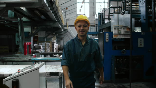 Confident-Man-Walking-through-Printing-Factory