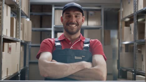 Warehouse-Worker-Wearing-Uniform-Crosses-Arms-and-Smiles.