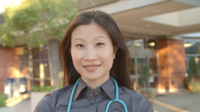 Portrait-Of-Female-Doctor-Standing-Hospital-Shot-On-R3D