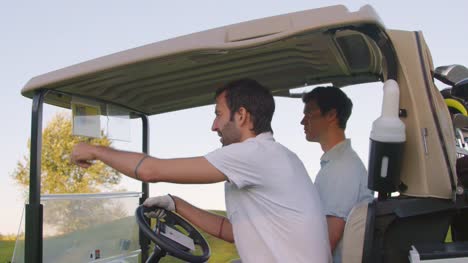 Close-up-of-golf-cart-and-riders