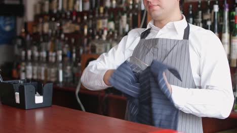 Bartender-wiping-glass-with-rag