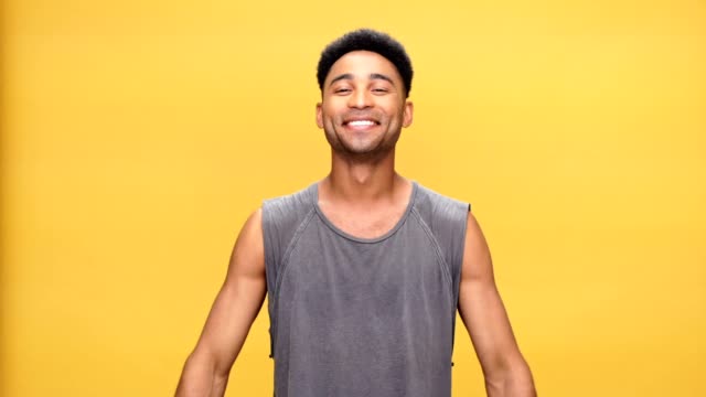Young-happy-african-man-pointing-to-himself-over-yellow-background.