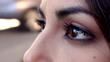 pensive-Asian-woman's-eyes-profile---outdoor--Macro