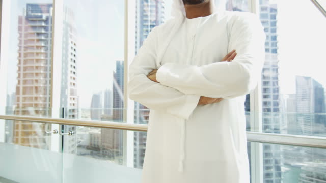 Portrait-male-Arabic-business-consultant-national-dress-downtown