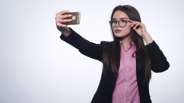 Girl-doing-self-phone-on-a-white-background