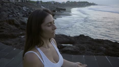 Mindful-Woman-Meditating-on-Coastline
