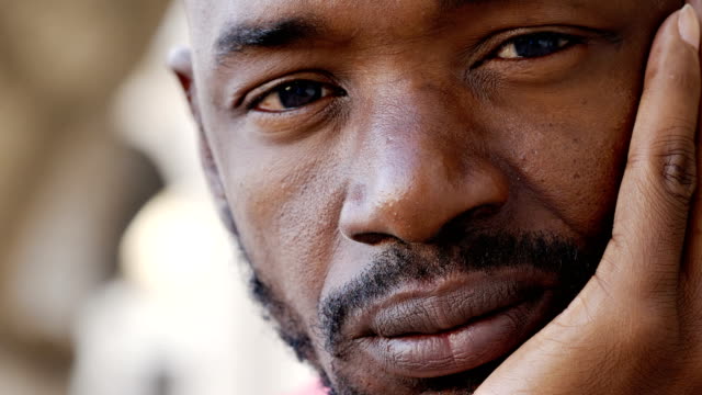 Pensive-look-of-a-young-African-black-man--close-up