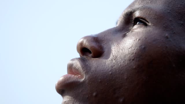 close-up-on-black-african-man-in-prayer,looking-the-sky