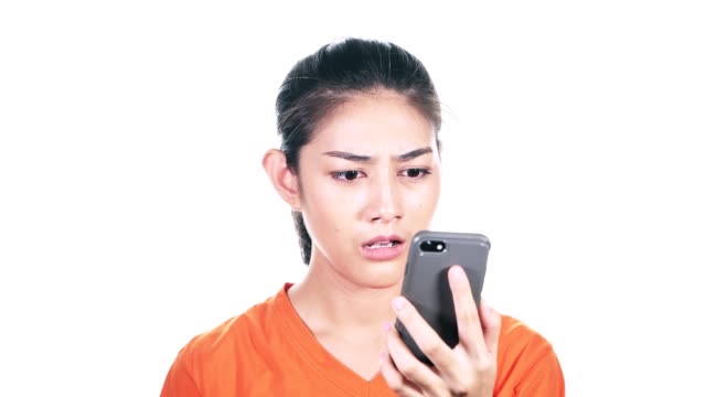Young-female-hipster-looking-at-her-phone-to-find-bad-news.-Asian-woman-looking-at-phone-and-very-upset-as-she-saw-bad-news-with-white-background.